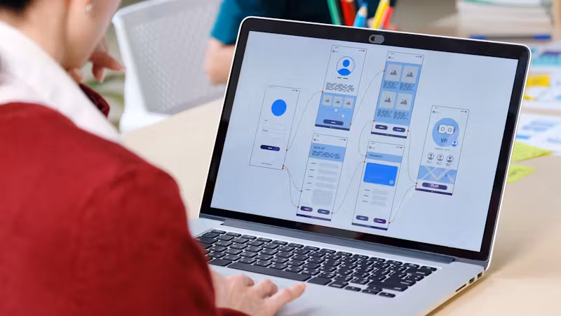 UX design flow wireframes on a whiteboard